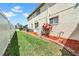 A neatly manicured backyard with a well-maintained lawn and privacy fence at 13122 Prestwick Dr, Riverview, FL 33579