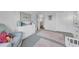 Well-organized bedroom with soft carpet, dresser, plush rugs, and comfortable seating at 13122 Prestwick Dr, Riverview, FL 33579