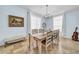 Charming dining room features a chandelier, large windows, and a unique decor at 13122 Prestwick Dr, Riverview, FL 33579
