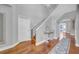 Bright entryway with hardwood floors, staircase, high ceiling, white walls, and charming decorative touches throughout at 13122 Prestwick Dr, Riverview, FL 33579