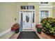 Charming front entrance with decorative door, plants, and welcome sign at 13122 Prestwick Dr, Riverview, FL 33579