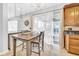 Bright kitchen with an island, wooden cabinetry, stainless steel appliances, and sliding glass doors to the pool at 13122 Prestwick Dr, Riverview, FL 33579