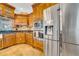 Well-equipped kitchen with stainless steel appliances, granite countertops, and custom wood cabinetry at 13122 Prestwick Dr, Riverview, FL 33579