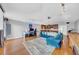 Open-concept living area with hardwood floors, recessed lighting, and a kitchen/bar area, creating a versatile entertaining space at 13122 Prestwick Dr, Riverview, FL 33579