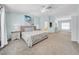 Spacious main bedroom with soft blue walls, plush carpet, and ample natural light, creating a serene and inviting retreat at 13122 Prestwick Dr, Riverview, FL 33579