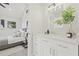 Bright bathroom offers a modern vanity and tranquil view to the connected bedroom at 1314 E Louise Ave, Tampa, FL 33603