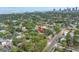 Aerial view of a property surrounded by lush greenery with a cityscape in the background, showcasing its prime location at 138 17Th N Ave, St Petersburg, FL 33704