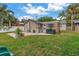 Well maintained backyard with brick patio, outdoor kitchen, and lush green lawn at 138 17Th N Ave, St Petersburg, FL 33704