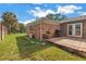 Spacious backyard with a patio, a grill, a lush lawn, and mature trees at 138 17Th N Ave, St Petersburg, FL 33704