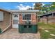 Backyard featuring brick patio, and an outdoor kitchen area with a grill at 138 17Th N Ave, St Petersburg, FL 33704