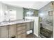 Elegant bathroom features double sinks, granite counters, and a luxurious shower at 138 17Th N Ave, St Petersburg, FL 33704