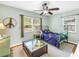 Cozy bedroom with a ceiling fan, two windows, and a green metal bed frame adding unique charm at 138 17Th N Ave, St Petersburg, FL 33704