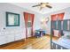 Bright bedroom featuring hardwood floors, a playful accent mirror, and colorful décor at 138 17Th N Ave, St Petersburg, FL 33704
