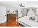 Spacious bedroom with wood floors, a dresser, and access to a back yard at 138 17Th N Ave, St Petersburg, FL 33704