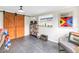 Bonus room with slate floors, barn doors, and a window overlooking the backyard at 138 17Th N Ave, St Petersburg, FL 33704