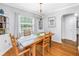 Bright dining room with wood floors, a modern light fixture, and a large window letting in natural light at 138 17Th N Ave, St Petersburg, FL 33704