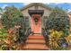 Inviting front door with decorative wreath, plants and brick steps, secured by ADT at 138 17Th N Ave, St Petersburg, FL 33704