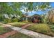 Charming single-story home with a beautifully landscaped front yard and brick walkway at 138 17Th N Ave, St Petersburg, FL 33704