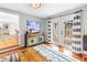 Relaxing living room with French doors, a colorful dresser, and stylish decor at 138 17Th N Ave, St Petersburg, FL 33704