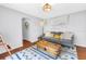 Cozy living room features a comfortable couch, a wood trunk, and an area rug at 138 17Th N Ave, St Petersburg, FL 33704