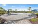Community splash pad area with lounge chairs and tables for relaxing by the water features at 14221 Eagle Branch Dr, Nokomis, FL 34275