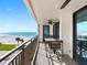 Relaxing outdoor balcony with seating, ceiling fan, and spectacular ocean views at 1430 Gulf Blvd # 309, Clearwater Beach, FL 33767