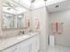 Bright bathroom featuring a vanity with granite countertop and ample storage space at 1430 Gulf Blvd # 309, Clearwater Beach, FL 33767