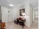 Neutral entryway featuring a console table, mirror, and carpeted flooring at 1430 Gulf Blvd # 309, Clearwater Beach, FL 33767