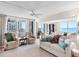 Spacious living room with neutral tones and sliding doors to a balcony with ocean views at 1430 Gulf Blvd # 309, Clearwater Beach, FL 33767