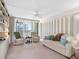 Relaxing living room with balcony access and comfortable seating arrangement, inviting ocean breeze at 1430 Gulf Blvd # 309, Clearwater Beach, FL 33767