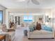 Bright living room featuring plush furnishings and views of the ocean at 1430 Gulf Blvd # 309, Clearwater Beach, FL 33767