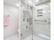 Bright shower featuring sleek glass enclosure, rain shower head, and convenient built-in niche at 1430 Gulf Blvd # 309, Clearwater Beach, FL 33767