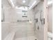 Modern shower with sleek glass enclosure, rain shower head, and convenient built-in bench at 1430 Gulf Blvd # 309, Clearwater Beach, FL 33767