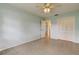This bedroom features neutral walls, a ceiling fan, and a tiled floor at 1466 Normandy Park Dr # 4, Clearwater, FL 33756