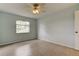 This bedroom boasts neutral walls and ceramic tile flooring at 1466 Normandy Park Dr # 4, Clearwater, FL 33756