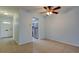 Open dining area featuring tile floors, a ceiling fan, and easy access to the kitchen and front entrance at 1466 Normandy Park Dr # 4, Clearwater, FL 33756