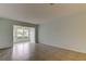 An additional view of the living room showcases the tile flooring and connection to the outdoor patio at 1466 Normandy Park Dr # 4, Clearwater, FL 33756