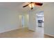 A bright living room offers a view into kitchen with stainless appliances, a seamless flow of living spaces at 1466 Normandy Park Dr # 4, Clearwater, FL 33756