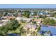 Beautiful aerial view of homes in a quaint neighborhood near a lake and lush greenery at 151 Harrisburg St, Port Charlotte, FL 33954