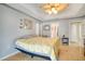 Bedroom featuring tiled floor and ensuite bathroom, creating a private retreat at 151 Harrisburg St, Port Charlotte, FL 33954