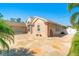 Exterior features an expansive driveway, attached garage, and well-maintained landscaping at 151 Harrisburg St, Port Charlotte, FL 33954
