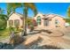 Beautifully landscaped home with paver driveway and tropical plants at 151 Harrisburg St, Port Charlotte, FL 33954