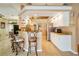 Bright kitchen with a breakfast bar, stainless steel refrigerator, granite countertops and stylish barstools at 151 Harrisburg St, Port Charlotte, FL 33954