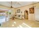 Cozy living room featuring tile floors, comfortable seating, and view of outdoor pool at 151 Harrisburg St, Port Charlotte, FL 33954