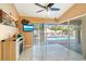 Comfortable sunroom with tile floors and sliding glass doors to the outdoor pool area at 151 Harrisburg St, Port Charlotte, FL 33954