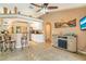 Open floor plan featuring kitchen, living room, and dining area, creating a spacious and inviting atmosphere at 151 Harrisburg St, Port Charlotte, FL 33954