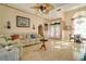 Bright, open living room featuring tile floors, comfortable seating, and view of front yard at 151 Harrisburg St, Port Charlotte, FL 33954