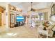 Bright living room with tile floors and open access to the outdoor patio at 151 Harrisburg St, Port Charlotte, FL 33954