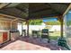 Patio area with an outdoor kitchen featuring modern appliances and ample counter space at 151 Harrisburg St, Port Charlotte, FL 33954