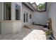 Charming courtyard with a peaceful fountain, tiled pavers, and lush landscaping at 17221 Breeders Cup Dr, Odessa, FL 33556